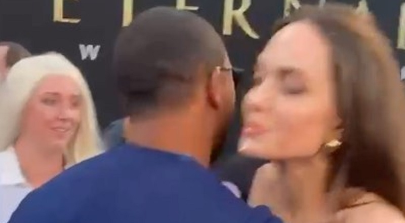 Angelina Jolie flirts with Romeo Miller on the Eternals red carpet