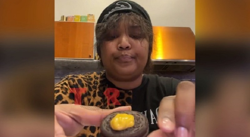 Lizzo eats Oreo with mustard on it