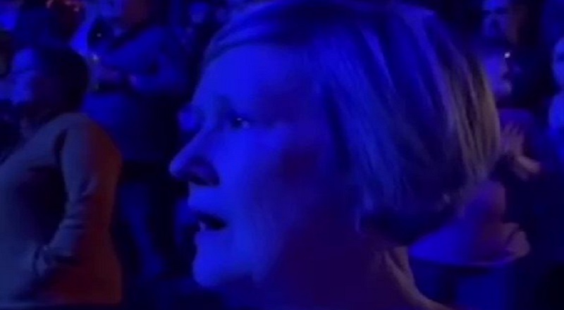 Older white woman goes into a trance during Kevin Gates concert