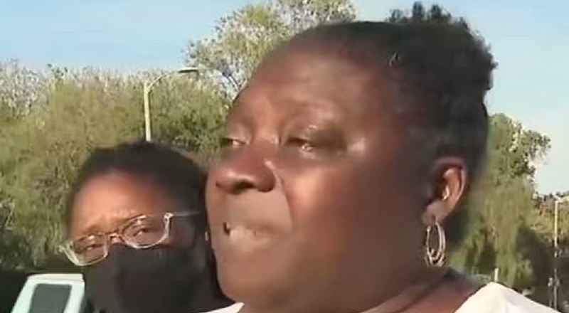 Mother throws up gang sign after saying her son was shot