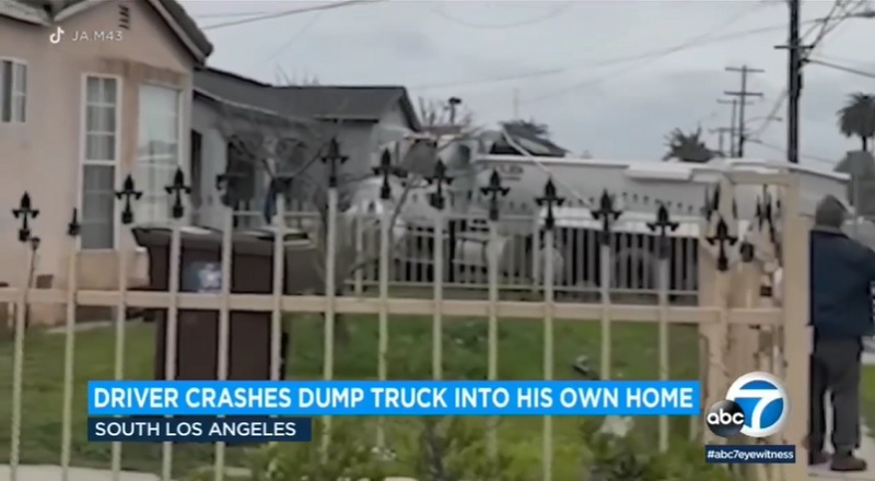 Man going through divorce drives dump truck into his own home