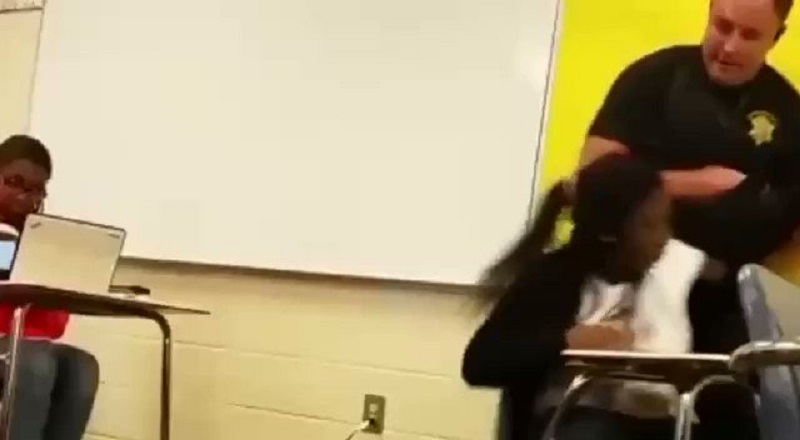 White deputy body slams Black female student in class