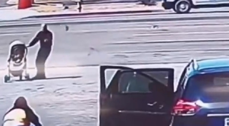 Man saves baby in stroller from rolling into traffic on highway