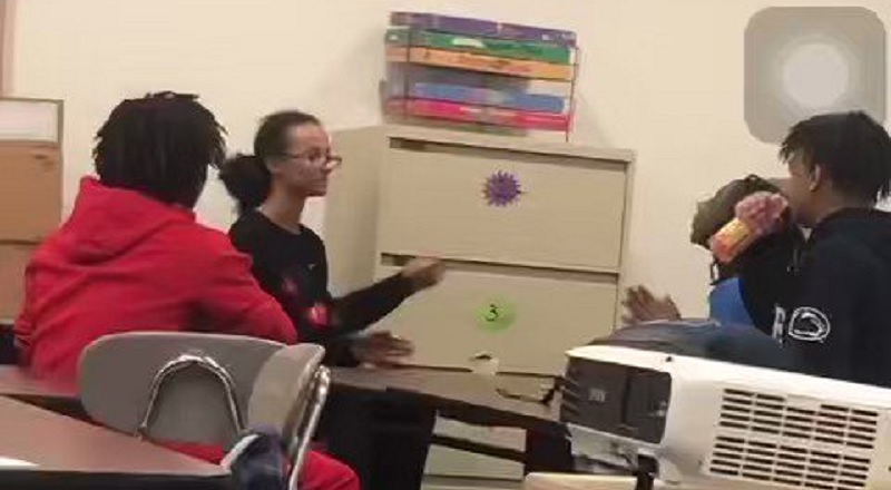 Teacher checks students for using the n-word in class
