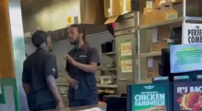 Two Wingstop employees fight inside of the store