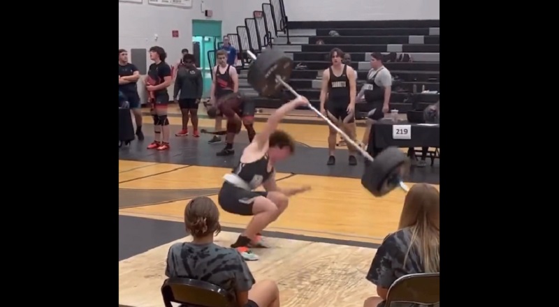 Kid narrowly misses dropping weights on his head in competition